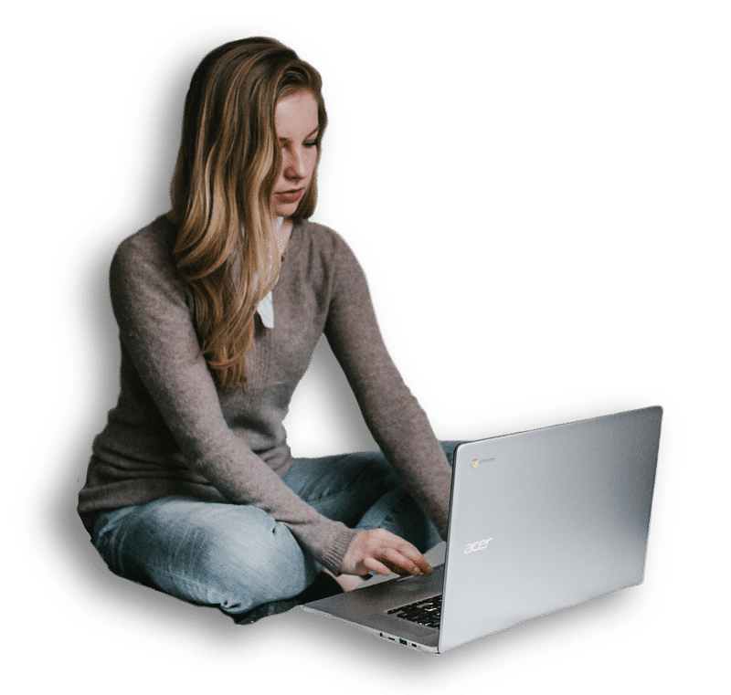 An image of a girl working on a laptop
